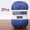 Two skeins of blue speckled yarn for crochet and knitting projects
