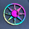 A colorful metal fidget spinner with a star design and iridescent finish.