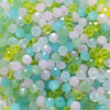 Mixed color faceted rondelle glass beads in shades of green, blue, and white for jewelry making