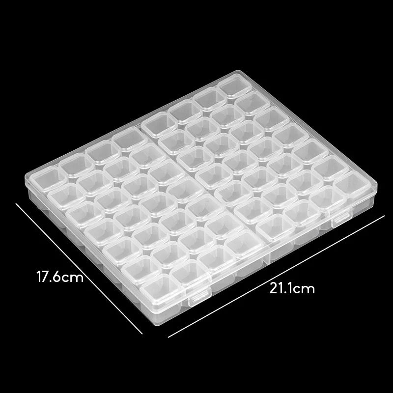 A transparent plastic tray with multiple small storage boxes for craft supplies, shown from above.