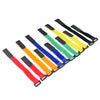 A set of five nylon bike handlebar straps in various colors including black, yellow, green, and blue.