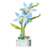 A building block set depicting a bouquet of rose flowers made from green and light blue blocks.