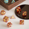 A set of colorful hexagon silicone resin molds and custom dice boxes displayed on a wooden tray.