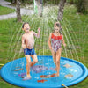 Two children are playing in a blue inflatable sprinkler mat outdoors on a grassy lawn.
