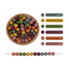 A collection of round silicone beads in various colors including gray, yellow, green, red, and pink, displayed next to a stri
