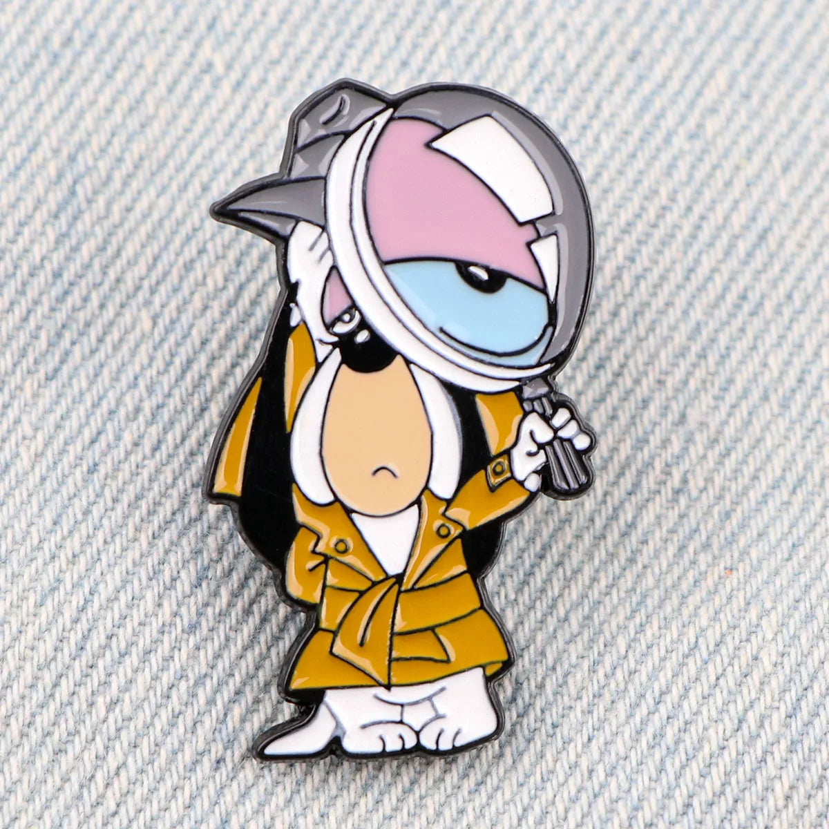 An enamel pin featuring a cartoon dog character wearing a helmet and holding a gun.