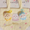 A yellow quilted bag with three plush keychains featuring characters like Usagi, Hachiware, and JiYi.