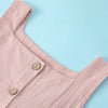 A light pink summer cotton linen jumper dress for a toddler girl, shown in a close-up view.
