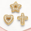 Gold tone crystal heart cross pendant with a star-shaped pendant displayed on a white background