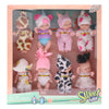A set of realistic mini reborn baby dolls with outfits and accessories displayed in packaging.