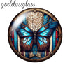 A round glass cabochon featuring a detailed blue butterfly design with gold accents.