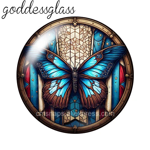 A round glass cabochon featuring a detailed blue butterfly design with gold accents.