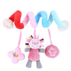 A colorful spiral sensory rattle toy featuring pink, red, blue, and light purple fabric strands with attached plush elements.