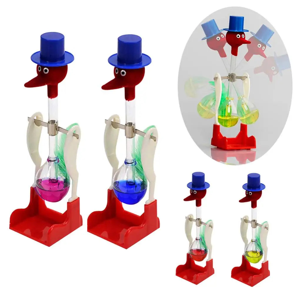 A set of classic drinking bird toys with blue and red hats, featuring perpetual motion desk decor.