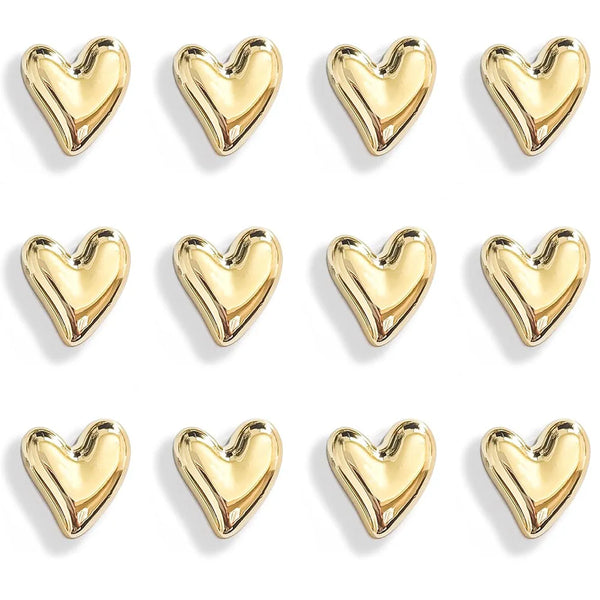 A set of twelve gold heart-shaped fridge magnets arranged in a grid.