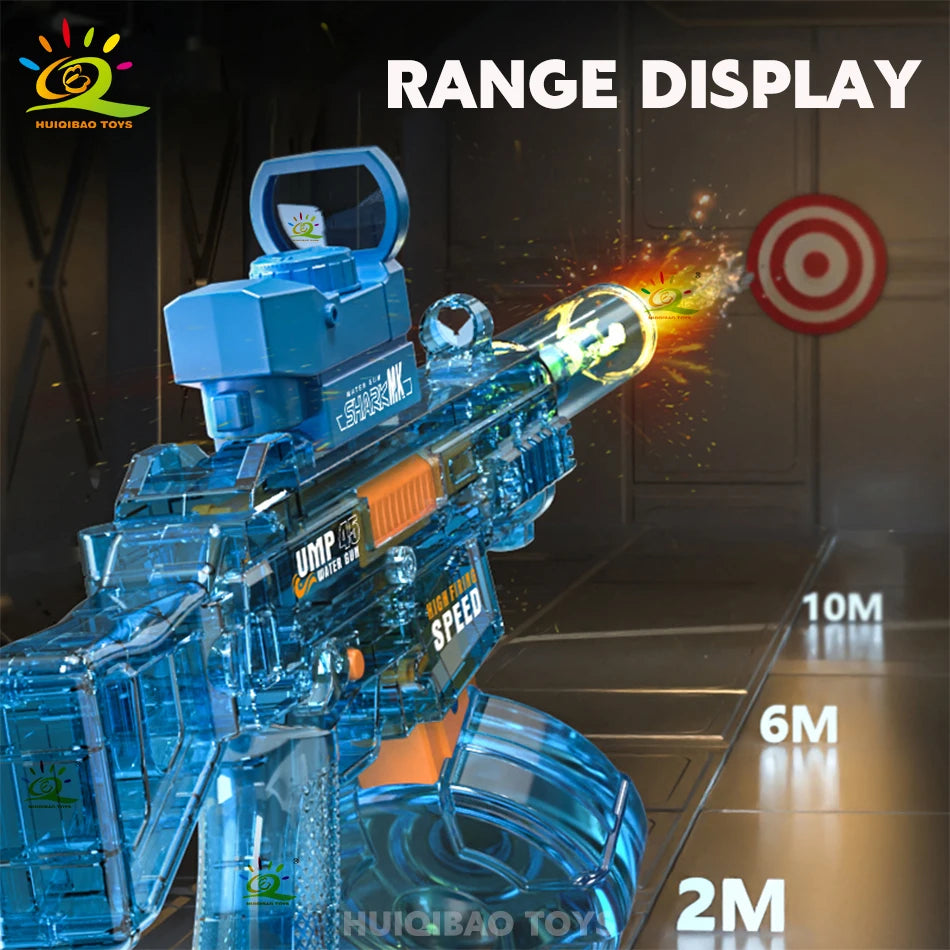 A blue automatic electric UMP45 water blaster is displayed, firing a stream of water toward a target.