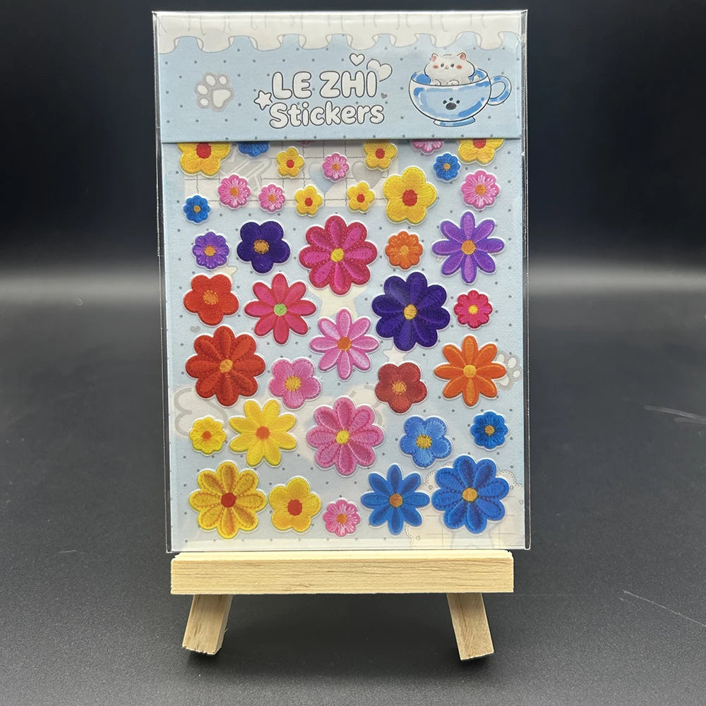A sheet of Le Zhi stickers featuring various colorful flowers and shapes for crafting