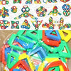 A pile of colorful, plastic snowflake-shaped building blocks in various bright colors like red, green, blue, and yellow.