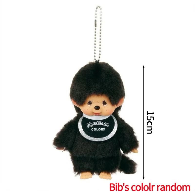 A small black plush cartoon character with a pom-pom head and a white collar hanging from a chain.