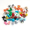 A collection of colorful poseable 3D printed animal figurine set featuring various small creatures and animals.