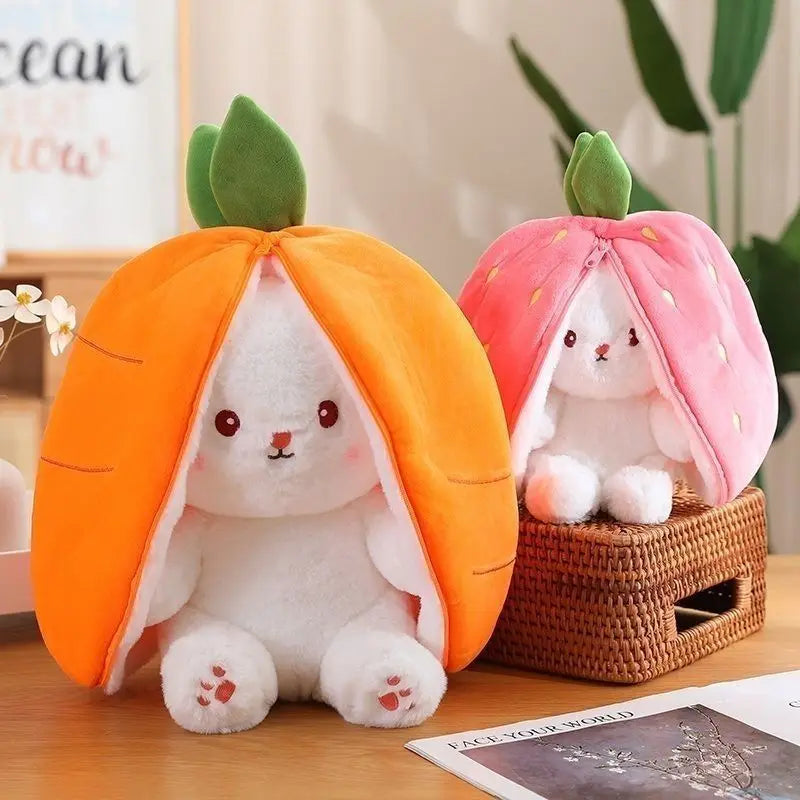 An orange fruit bunny plush toy with pink accents sitting on a wooden surface.