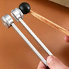 A set of metal tuning forks with wooden handles is held by a hand, used for sound healing and meditation.