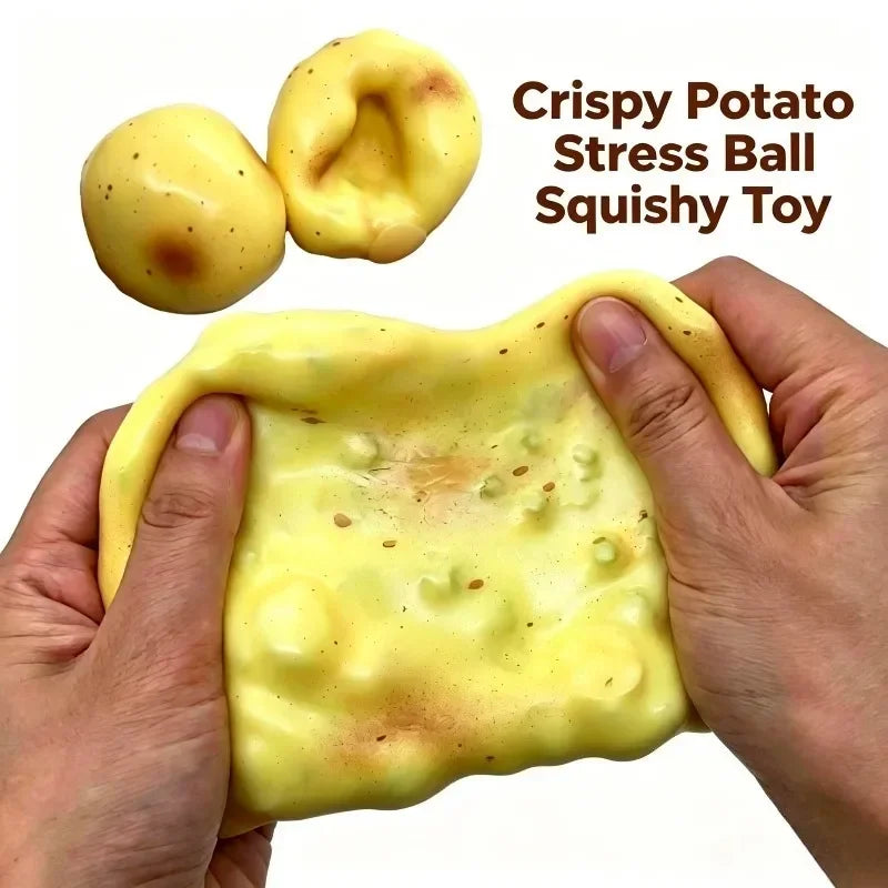 A hand is squeezing a yellow crispy potato stress ball squishy toy.