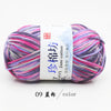 A ball of purple and pink yarn labeled as Jin Jane cotton yarn for knitting and crochet