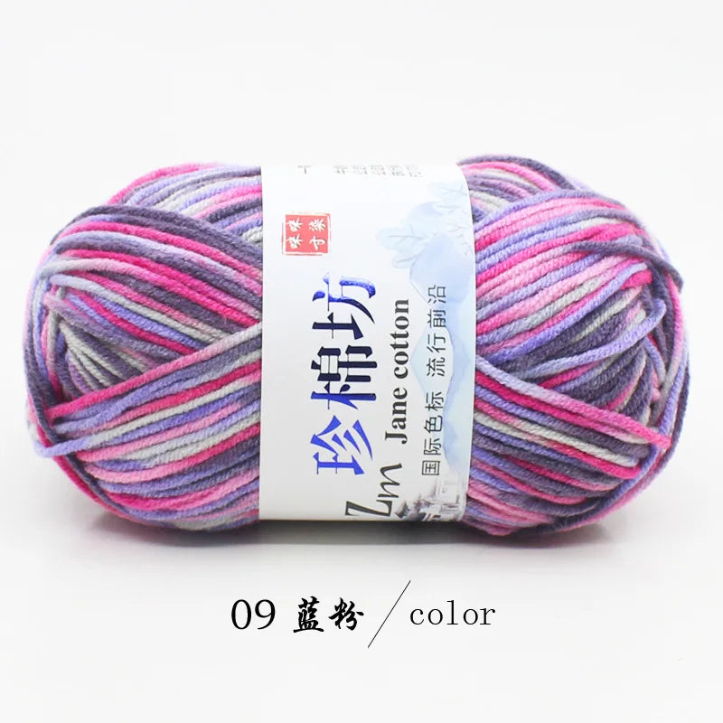 A ball of purple and pink yarn labeled as Jin Jane cotton yarn for knitting and crochet