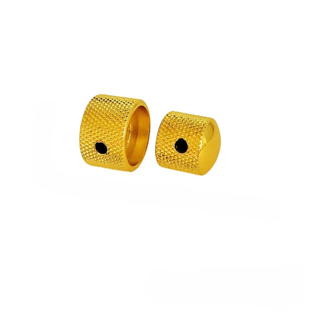 A set of two gold-colored dual concentric stacked control knobs for electric guitar and bass.