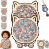 A wooden jigsaw puzzle shaped like a cat, featuring various cats and kittens in a collage style.
