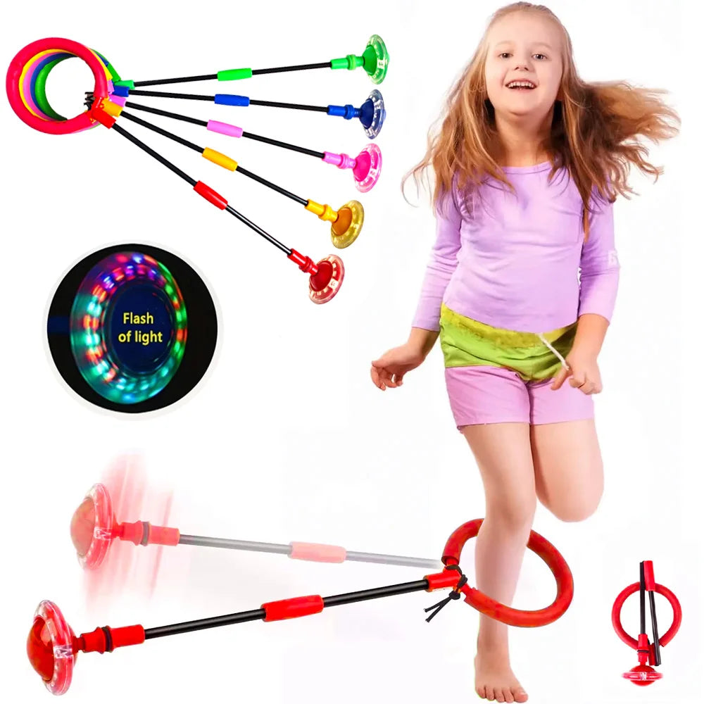 A young girl is playing with a colorful flash of light ball and tethered balls for kids.