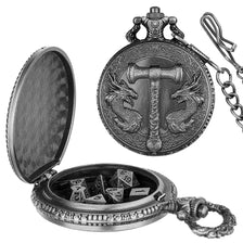 A detailed silver steampunk dragon pocket watch dice case with a lid and an attached chain.