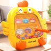 A yellow, squid-shaped magnetic puzzle board with numbered colored discs for a maze game.