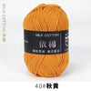 A ball of orange milk cotton yarn labeled with Chinese characters and the designation 40# Autumn Yellow.