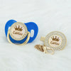 Personalized rose gold crown pacifier and clip set with a blue silicone holder