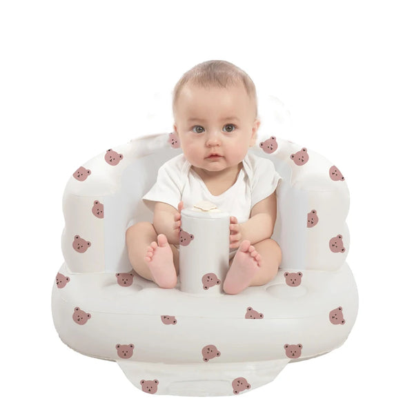 A baby is seated in a white inflatable baby seat designed for toddlers.