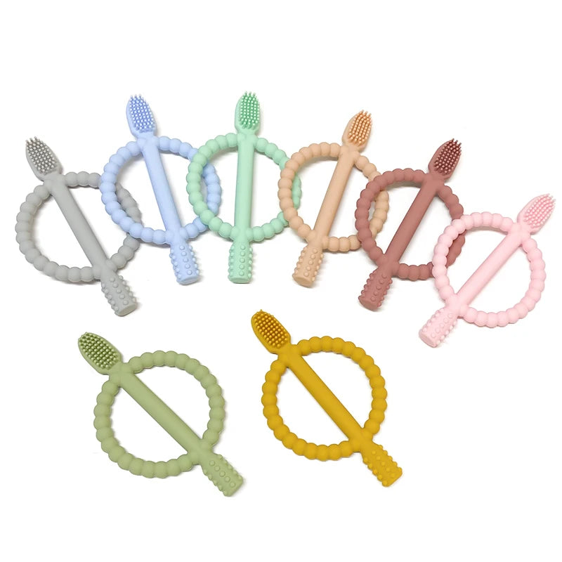 A collection of soft silicone baby teethers in various pastel colors, including blue, green, pink, and yellow.