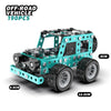 A teal off-road vehicle model made of metal building blocks with large tires and chassis components.