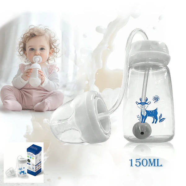 A clear silicone self-feeding bottle with a cleaning brush and a baby feeding it.