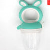 A silicone baby food feeder with a teal-colored top and a clear container.
