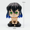 A figure set of Tanjiro and Nezuko from Demon Slayer, featuring black hair and green eyes.
