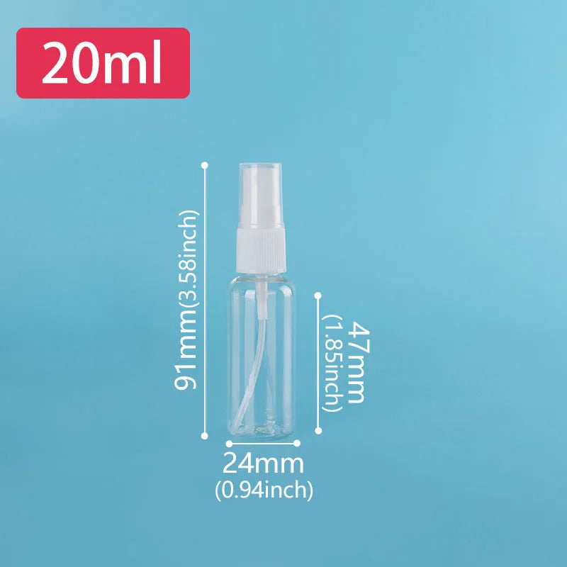 A clear glass spray bottle with a fine mist pump is shown against a light blue background.