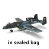 A detailed plastic model of an A-10 Warthog aircraft in a gray and black camouflage scheme.