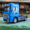 A blue 1:50 scale diecast model of a Mercedes-Benz Actros container truck with lights and sounds.