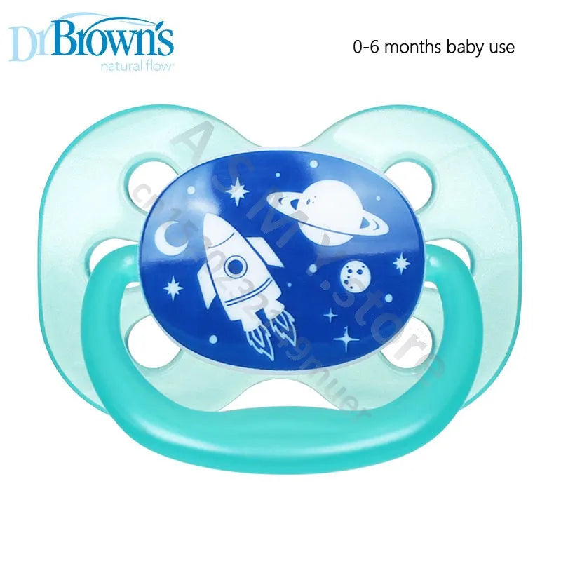 A light blue silicone pacifier soother with a blue disc featuring an astronaut and a planet.