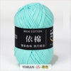 A ball of light mint green milk cotton yarn labeled with Chinese characters and a YIMIAN code.