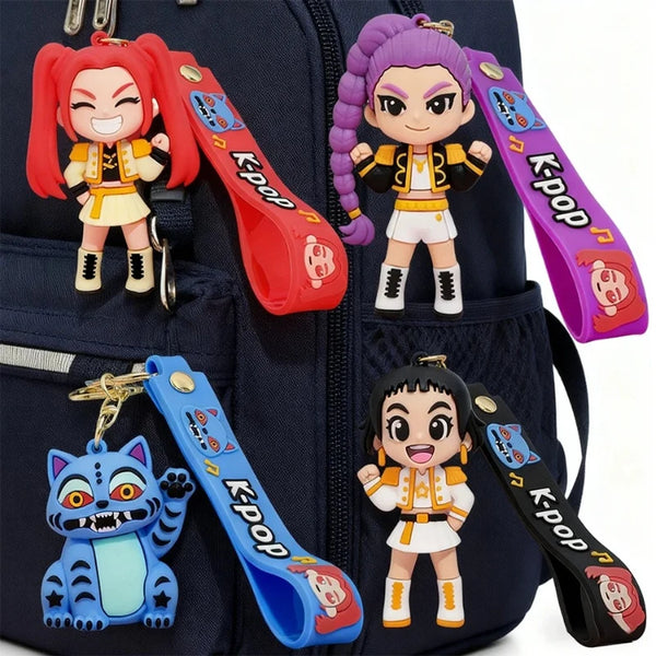 A dark blue backpack featuring several Keypop collectible dolls and keychains.