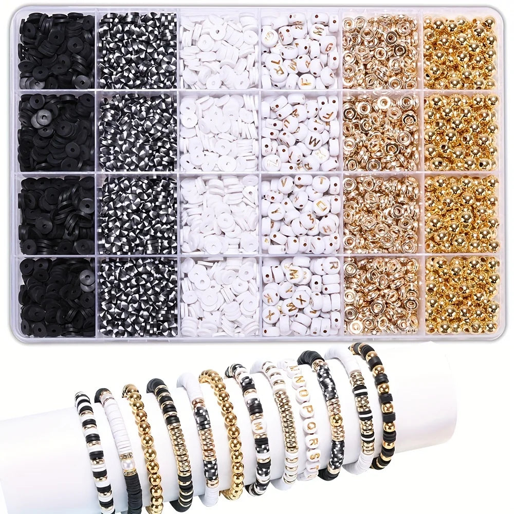 A variety of black, white, and gold beads and alphabet beads are displayed in a compartmentalized kit for DIY jewelry making.