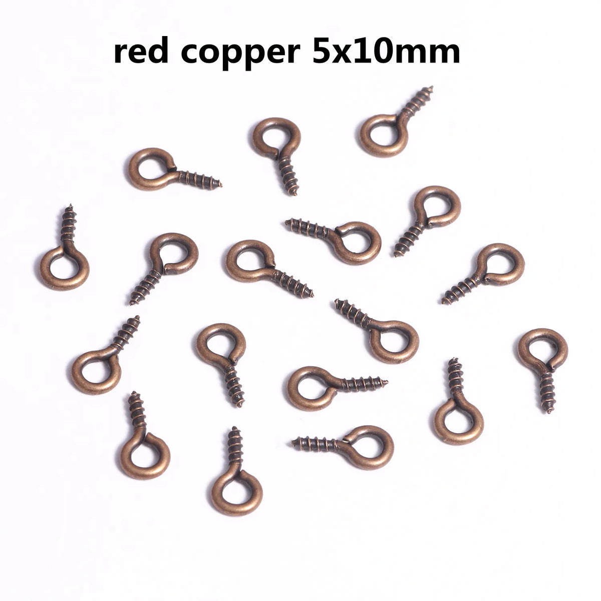 A collection of red copper eye pins with screw threads for jewelry making.